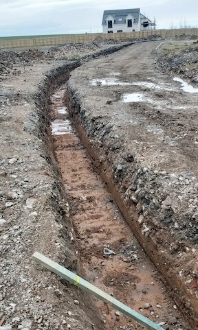 Utilities trench being created at Wellbank Park